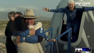 Billionaire businessman Jeff Bezos and pioneering female aviator Wally Funk emerge from their capsule after their flight aboard Blue Origin's New Shepard rocket on the world's first unpiloted suborbital flight near Van Horn, Texas, U.S., July 20, 2021 in a still image from video.  Blue Origin/Handout via REUTERS.     NO RESALES. NO ARCHIVES. THIS IMAGE HAS BEEN SUPPLIED BY A THIRD PARTY.