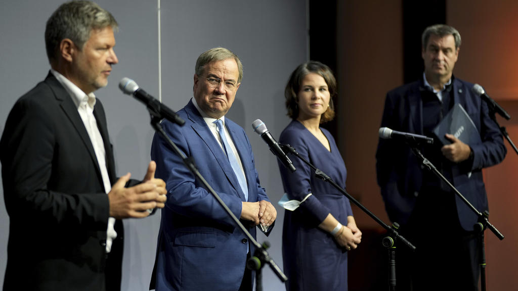 From left, Robert Habeck, co-chairman of the German Green party (Die Gruenen), Armin Laschet, chairman of the German Christian Democratic Party (CDU), Annalena Baerbock, co-chairwoman of the German Green party (Die Gruenen), and Markus Soeder, chairm