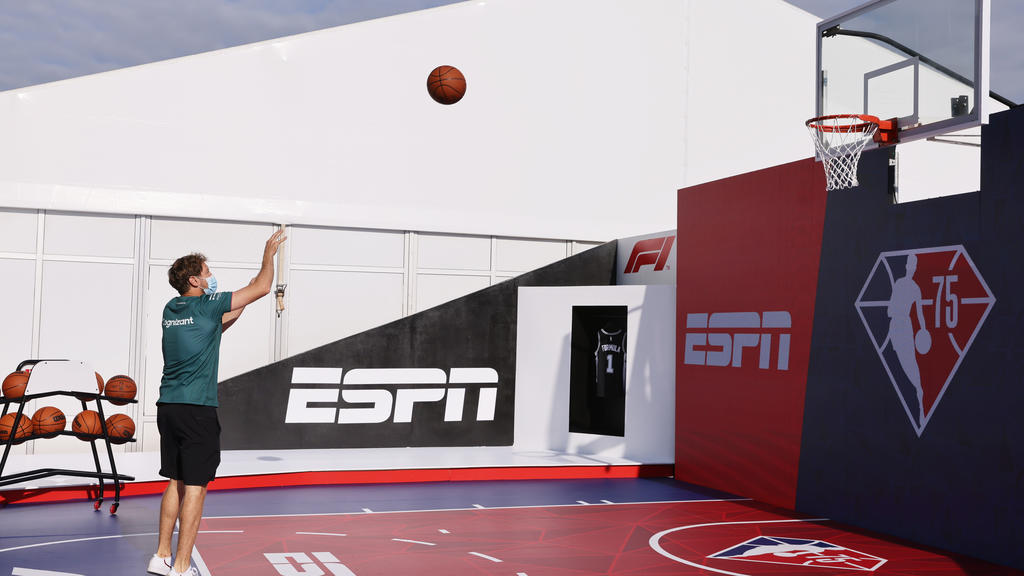 Formula One F1 - United States Grand Prix - Circuit of the Americas, Austin, Texas, U.S. - October 21, 2021 Aston Martin's Sebastian Vettel plays basketball in the paddock ahead of the Grand Prix REUTERS/Mike Blake