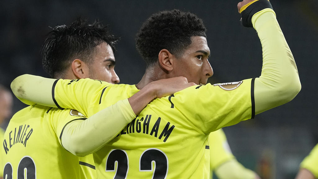 Dortmund's Reinier, left, and Dortmund's Jude Bellingham celebrate after Dortmund's Thorgan Hazard scored his side's opening goal during the German Soccer Cup match between Borussia Dortmund and FC Ingolstadt 04 in Dortmund, Germany, Tuesday, Oct. 26