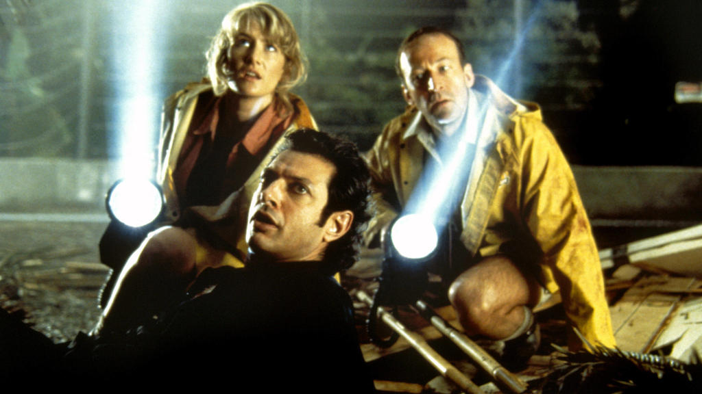 Immer auf der Hut vor Dinosauriern: Laura Dern, Jeff Goldblum und Bob Peck.