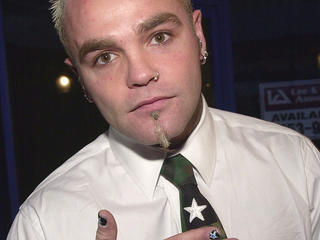 387582 11: Recording artist Seth Binzer of the music group "Crazy Town" arrives at the world premiere of Universal Pictures'' "Josie and the Pussycats" April 9, 2001 at the GCC Galaxy Theatre in Hollywood, CA. "''Josie" opens April 9, 2001 in theatres across the United States. (Photo by Chris Weeks/Liaison)