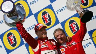 German Formula One driver Michael Schumacher (Ferrari) and his teamchief French Jean Todt (R) jubilate on the podium after the Grand Prix of San Marino at the F1 race track in Imola, Italy, Sunday 23 April 2006. Photo: Gero Breloer +++(c) dpa - Bildfunk+++