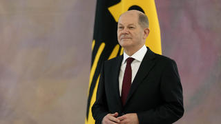 German Chancellor Olaf Scholz, right, looks on as German President Frank-Walter Steinmeier, left, speaks, prior to presenting the letters of appointment to the new German federal ministers during a reception at Bellevue Palace in Berlin, Germany, Wednesday, Dec. 8, 2021. Scholz has become Germany's ninth post-World War II chancellor, opening a new era for the European Union's most populous nation and largest economy after Angela Merkel's 16-year tenure. Scholz's government takes office with high hopes of modernizing. (AP Photo/Michael Sohn)