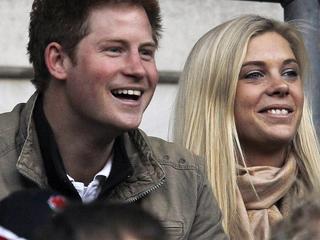 Britain's Prince Harry (L) and Chelsy Davy attend the friendly international rugby union match between England and Australia at Twickenham in London in this November 7, 2009 file photo. Prince Harry and Chelsy Davy are rumoured to be among the 1,900 guests invited to attend the wedding of Britain's Prince William and Kate Middleton on April 29, 2011, according to local media. REUTERS/ Eddie Keogh/Files (BRITAIN - Tags: ROYALS SPORT RUGBY)