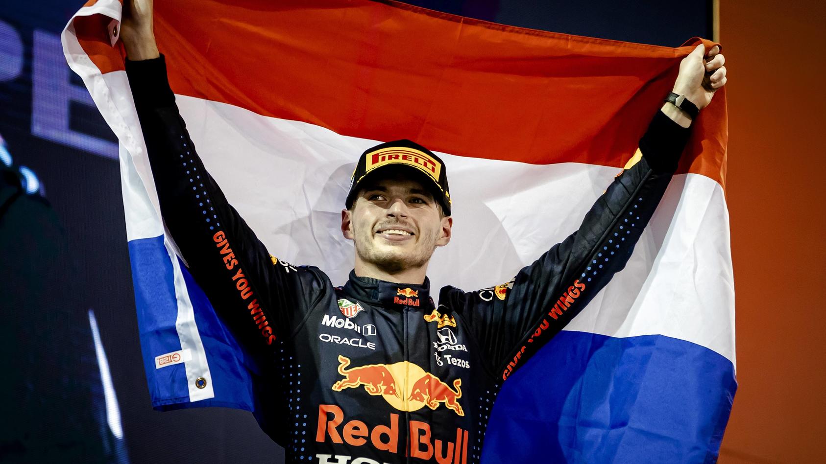  ABU DHABI - Red Bull Racing s Max Verstappen on the podium after winning the Formula 1 World Championship, WM, Weltmeisterschaft after the Abu Dhabi Grand Prix at Yas Marina Circuit on December 12, 2021 in Abu Dhabi, United Arab Emirates. REMKO DE W