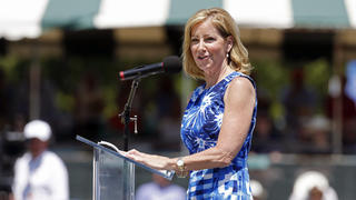 FILE -Chris Evert speaks during the induction ceremony at the International Tennis Hall of Fame in Newport, R.I., Saturday, July 12, 2014. Former tennis star Chris Evert says she was diagnosed with an early stage of ovarian cancer. The 67-year-old Evert revealed the illness in a story posted Friday, Jan. 14, 2022 on ESPN.com. (AP Photo/Michael Dwyer, File)