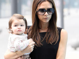 Victoria Beckham and baby Harper check out a shop in Beijing close to her hotel. Victoria was followed by a few fans as she had a short walk.