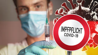 Coronavirus Impfpflicht - Schild mit der Aufschrift Impfpflicht, Allgemeine Impfpflicht in Deutschland Symbolbild