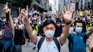 July 1, 2020, Hong Kong, China: Protesters making gestures of 1 and 5 fingers, symbolising the five demands of the protest movement during the demonstration..Following the passing of the National Security Law that would tighten on freedom of expression, Hong Kong protesters marched on the streets to demonstrate. Protesters chanted slogans, sang songs, and obstructed roads. Later, riot police officers arrested several protesters using paintballs and pepper spray. Hong Kong China - ZUMAs197 20200701_zaa_s197_159 Copyright: xWilliexSiawilliexSiaux 
