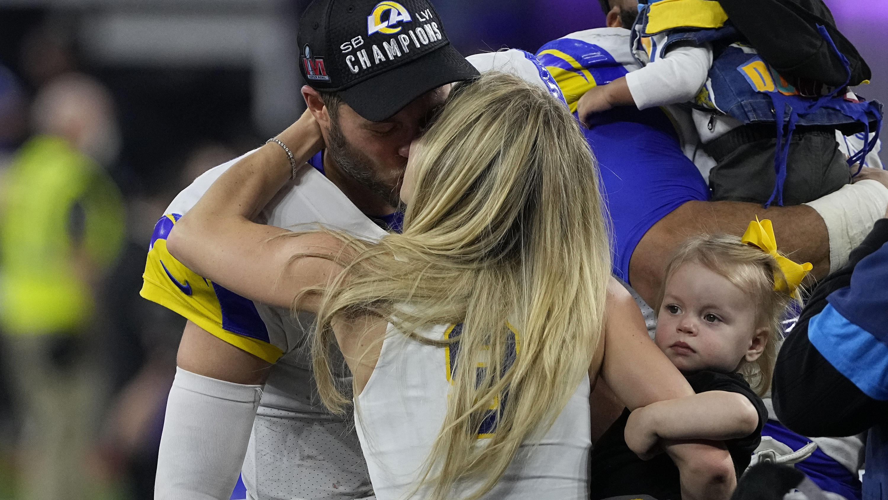Los Angeles Rams quarterback Matthew Stafford kisses his wife Kelly Hall after the NFL Super Bowl 56 football game against the Cincinnati Bengals, Sunday, Feb. 13, 2022, in Inglewood, Calif. The Los Angeles Rams won 23-20. (AP Photo/Tony Gutierrez)