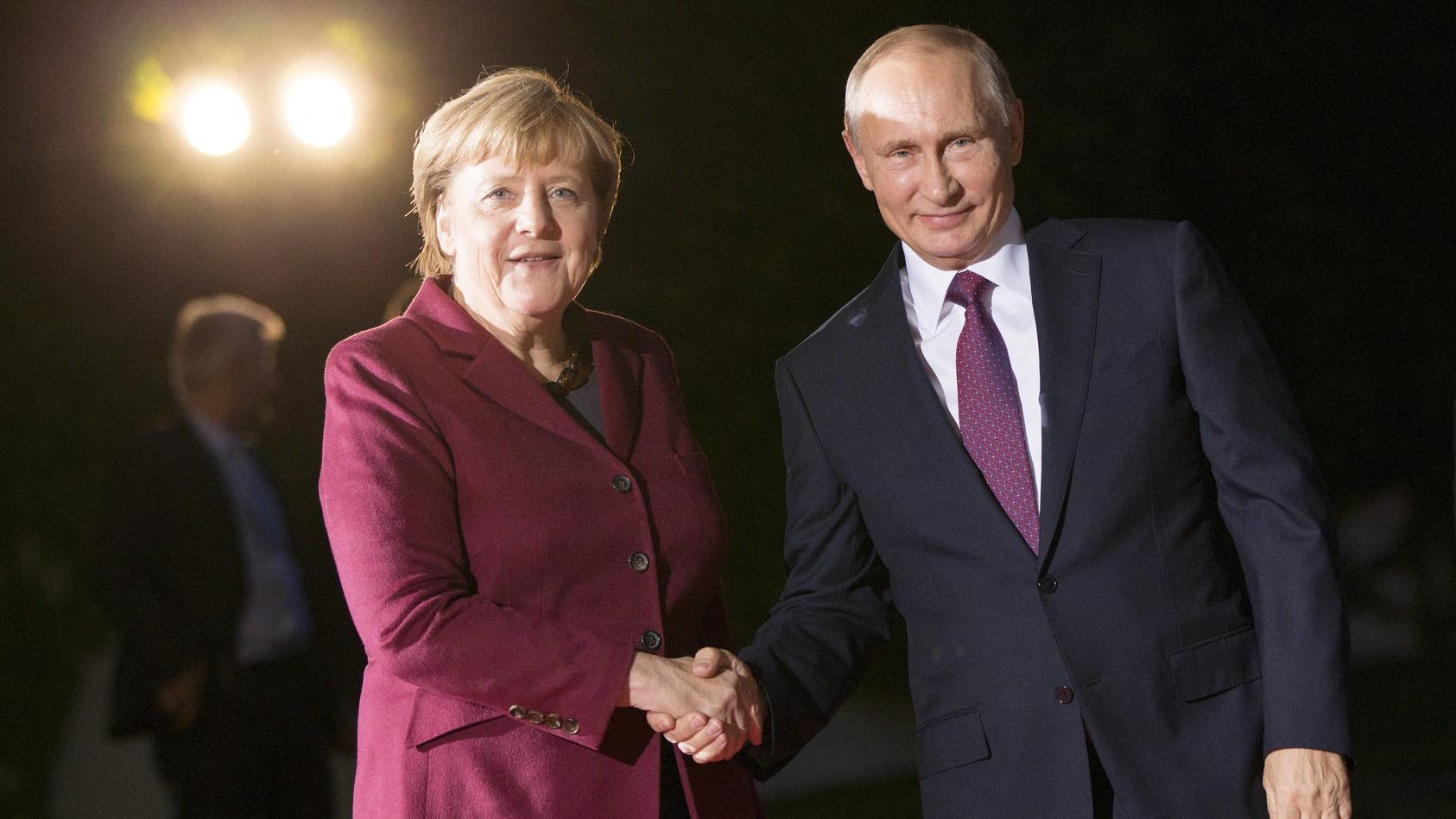 October 19, 2016 - Berlin, Germany - German Chancellor Angela Merkel and Russian President Vladimir Putin pose for the photographers upon his arrival at the Chancellery in Berlin, Germany on October 19, 2016. German Chancellor Angela Merkel is meetin