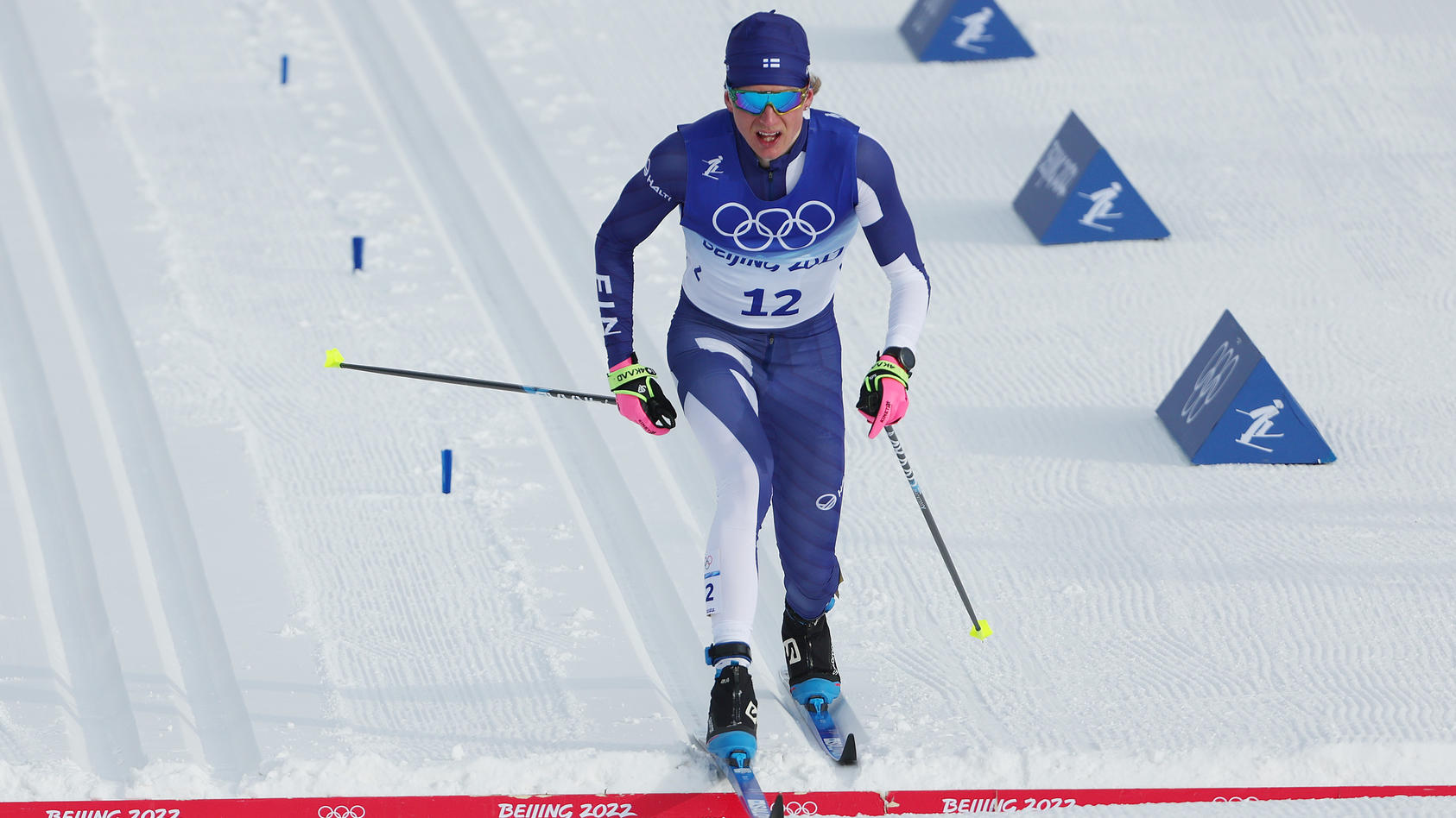 ZHANGJIAKOU, CHINA - FEBRUARY 11: Remi Lindholm of Team Finland crosses the finish line during the Men's Cross-Country Skiing 15km Classic on Day 7 of  Beijing 2022 Winter Olympics at The National Cross-Country Skiing Centre on February 11, 2022 in Z