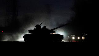 A tank drives along a street after Russian President Vladimir Putin ordered the deployment of Russian troops to two breakaway regions in eastern Ukraine following the recognition of their independence, in the separatist-controlled city of Donetsk, Ukraine February 22, 2022. REUTERS/Alexander Ermochenko     TPX IMAGES OF THE DAY