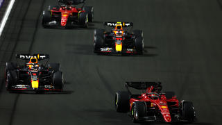 JEDDAH, SAUDI ARABIA - MARCH 27: Charles Leclerc of Monaco driving (16) the Ferrari F1-75 leads Max Verstappen of the Netherlands driving the (1) Oracle Red Bull Racing RB18, Sergio Perez of Mexico driving the (11) Oracle Red Bull Racing RB18 and Carlos Sainz of Spain driving (55) the Ferrari F1-75 on track during the F1 Grand Prix of Saudi Arabia at the Jeddah Corniche Circuit on March 27, 2022 in Jeddah, Saudi Arabia. (Photo by Lars Baron/Getty Images)