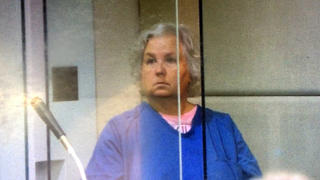 FILE - In this screen shot from video of her court appearance, romance writer Nancy Crampton Brophy appears in Multnomah County Circuit Court in Portland, Ore., on Sept. 6, 2018, on one count of murder with a firearm constituting domestic violence in the June death of her husband, Daniel Brophy, a chef at the Oregon Culinary Institute who was found shot in the school's kitchen. Crampton Brophy's trial started Monday, April 4, 2022. (Multnomah County Circuit Court/Courtesy of The Oregonian via AP, File)