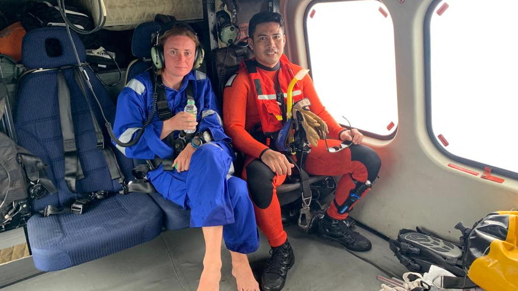Norwegian diver Kristine Grodem is transferred by a Malaysian Maritime Enforcement Agency (MMEA) helicopter to Mersing, after being rescued off the Mersing coast, Johor, Malaysia, April 7, 2022. Malaysian Maritime Enforcement Agency/Handout via REUTE