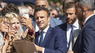  220424 -- LE TOUQUET, April 24, 2022 -- French President Emmanuel Macron poses for photos with his supporters before casting his ballot in Le Touquet, northern France, April 24, 2022. The 2022 French presidential runoff kicked off at 8 a.m. local time 0600 GMT on Sunday in Metropolitan France between incumbent President Emmanuel Macron and candidate Marine Le Pen. Photo by /Xinhua FRANCE-LE TOUQUET-PRESIDENTIAL ELECTION-SECOND ROUND-VOTE-MACRON AngelinixHans PUBLICATIONxNOTxINxCHN