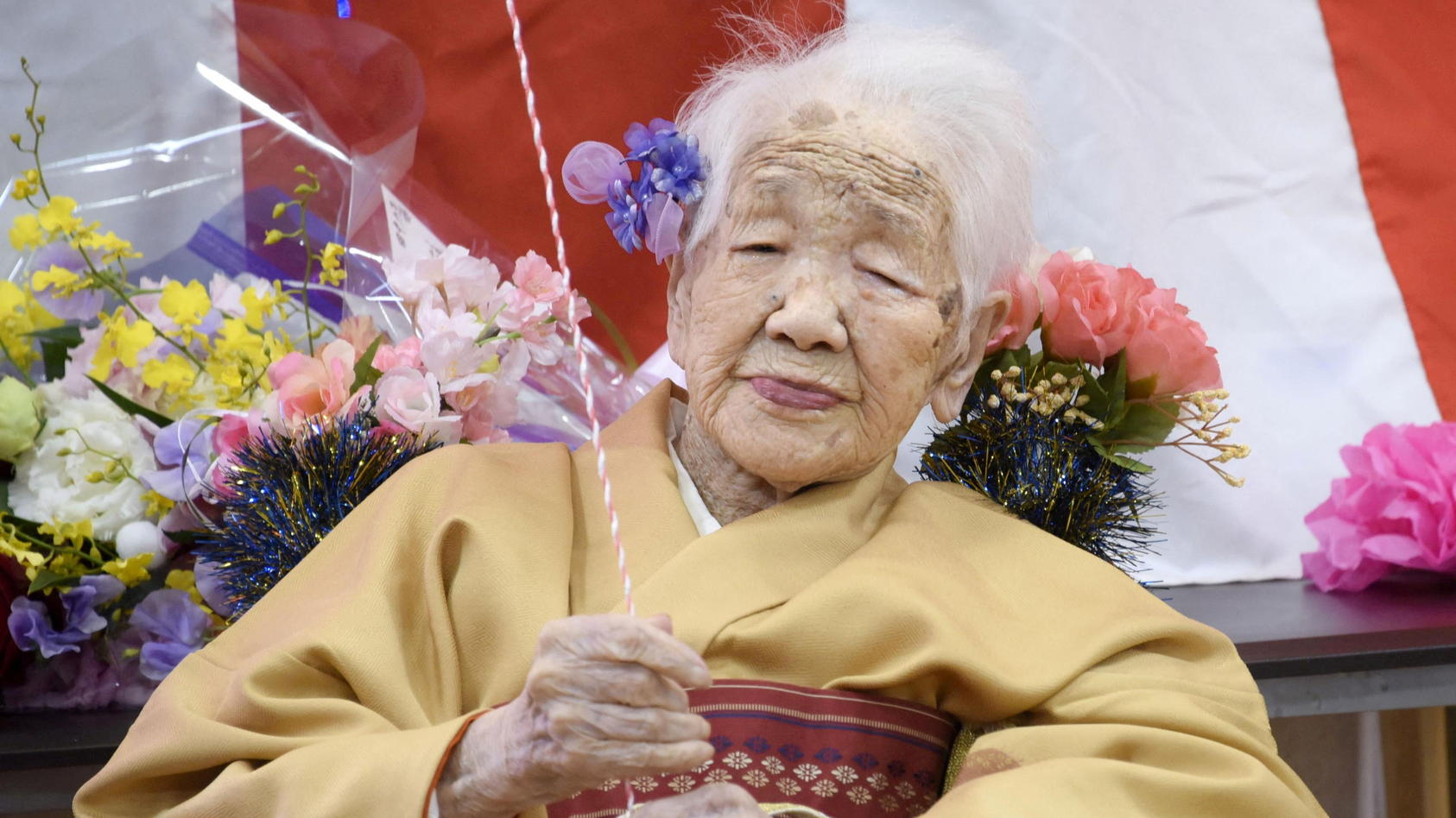 FILE PHOTO: Kane Tanaka, born in 1903, smiles as a nursing home celebrates three days after her 117th birthday in Fukuoka, Japan, in this photo taken by Kyodo January 5, 2020. Mandatory credit Kyodo/via REUTERS ATTENTION EDITORS - THIS IMAGE WAS PROV