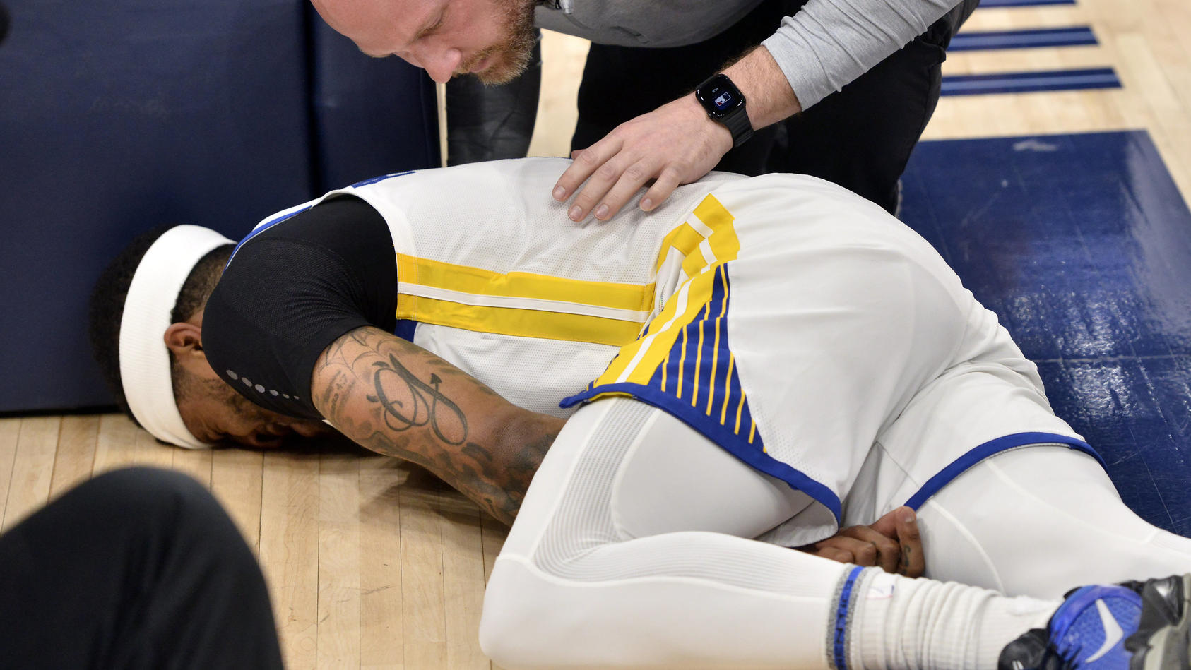 Golden State Warriors guard Gary Payton II lies on the court after being fouled during the first half of Game 2 of the team's second-round NBA basketball playoff series against the Memphis Grizzlies on Tuesday, May 3, 2022, in Memphis, Tenn. (AP Phot