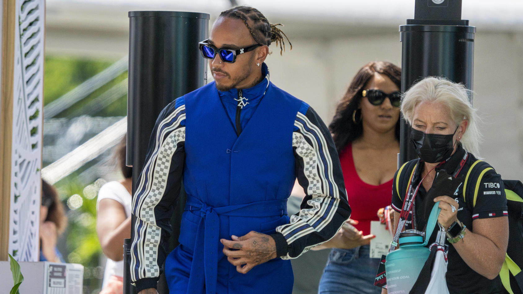  British Formula One driver Lewis Hamilton of Mercedes-AMG Petronas F1 Team and his physiotherapist and assistant Angela Cullen arrive in the paddock during the Formula One Grand Prix of Miami at the Miami International Autodrome in Miami, Florida on