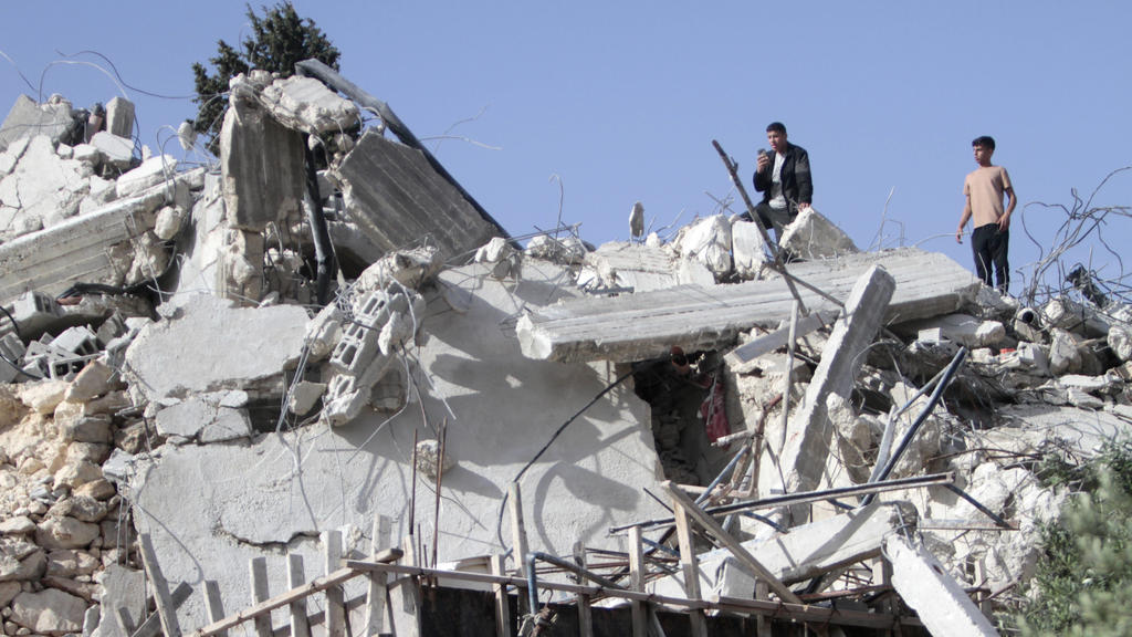  May 9, 2022, Nablus, West bank, Palestine: Palestinians inspect the remains of a house demolished by the Israeli army. The Israeli occupation army demolished two Palestinian homes under the pretext of non-licensing in the village of Beit Dajan, east
