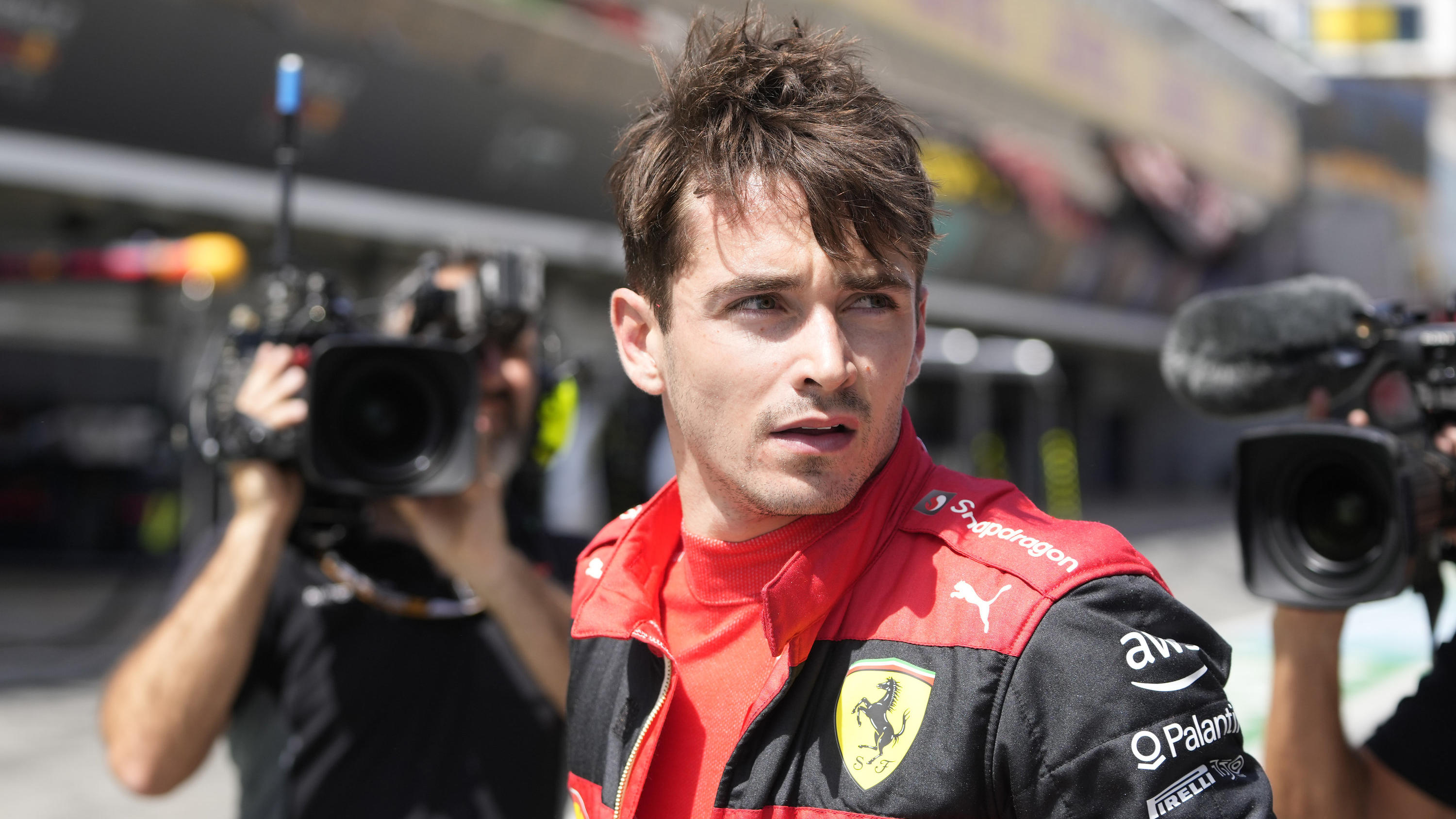 Ferrari driver Charles Leclerc of Monaco walks at the pit lane after his car's breakdown during the Spanish Formula One Grand Prix at the Barcelona Catalunya racetrack in Montmelo, Spain, Sunday, May 22, 2022. (AP Photo/Pool/Manu Fernandez)
