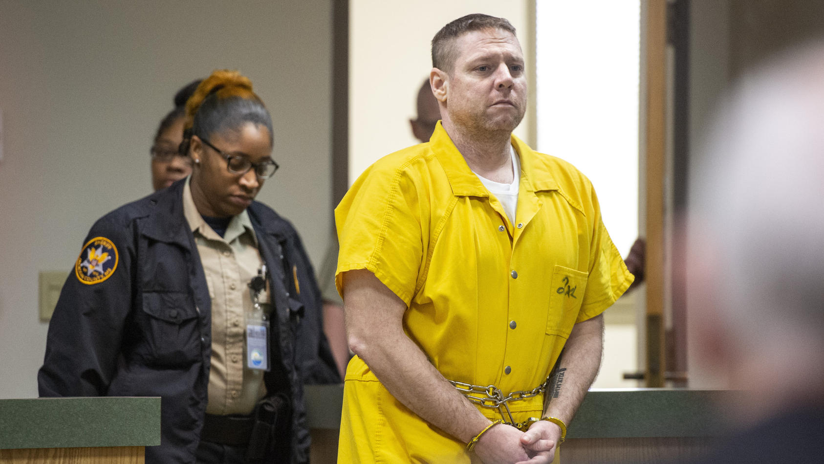 Jacob Blair Scott is led into the courtroom for his sentencing hearing following a trial in which the jury gave its verdict that Scott was guilty on all charges in Jackson County Circuit Court in Pascagoula, Miss., on Thursday, June 2, 2022. Scott, c