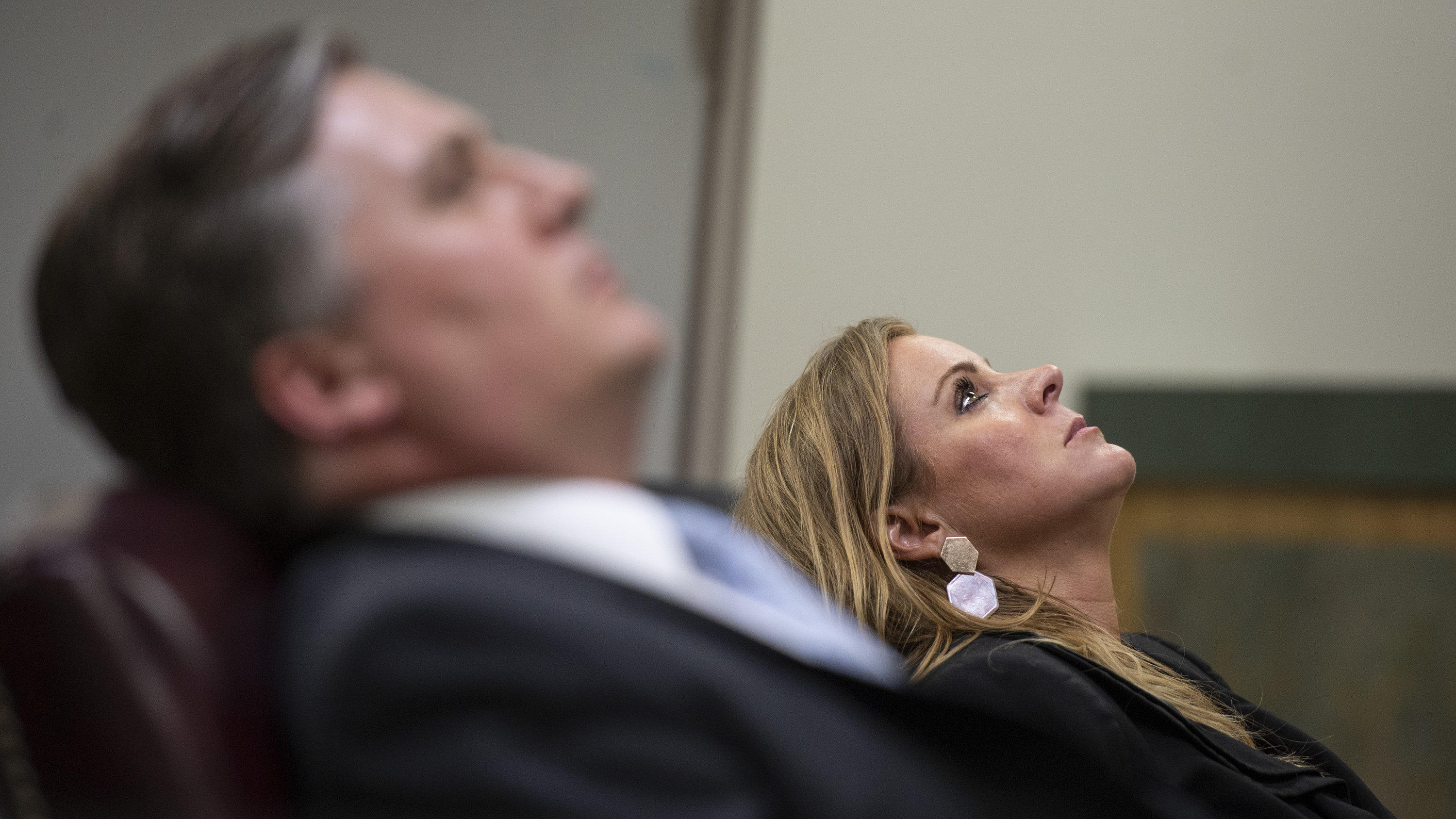 Prosecuting attorneys District Attorney Angel Myers McIlrath, right, and Assistant District Attorney Justin Lovorn lean back in their chairs as Jacob Blair Scott rambles while answering a question as he testifies during his trial for sexual abuse on 