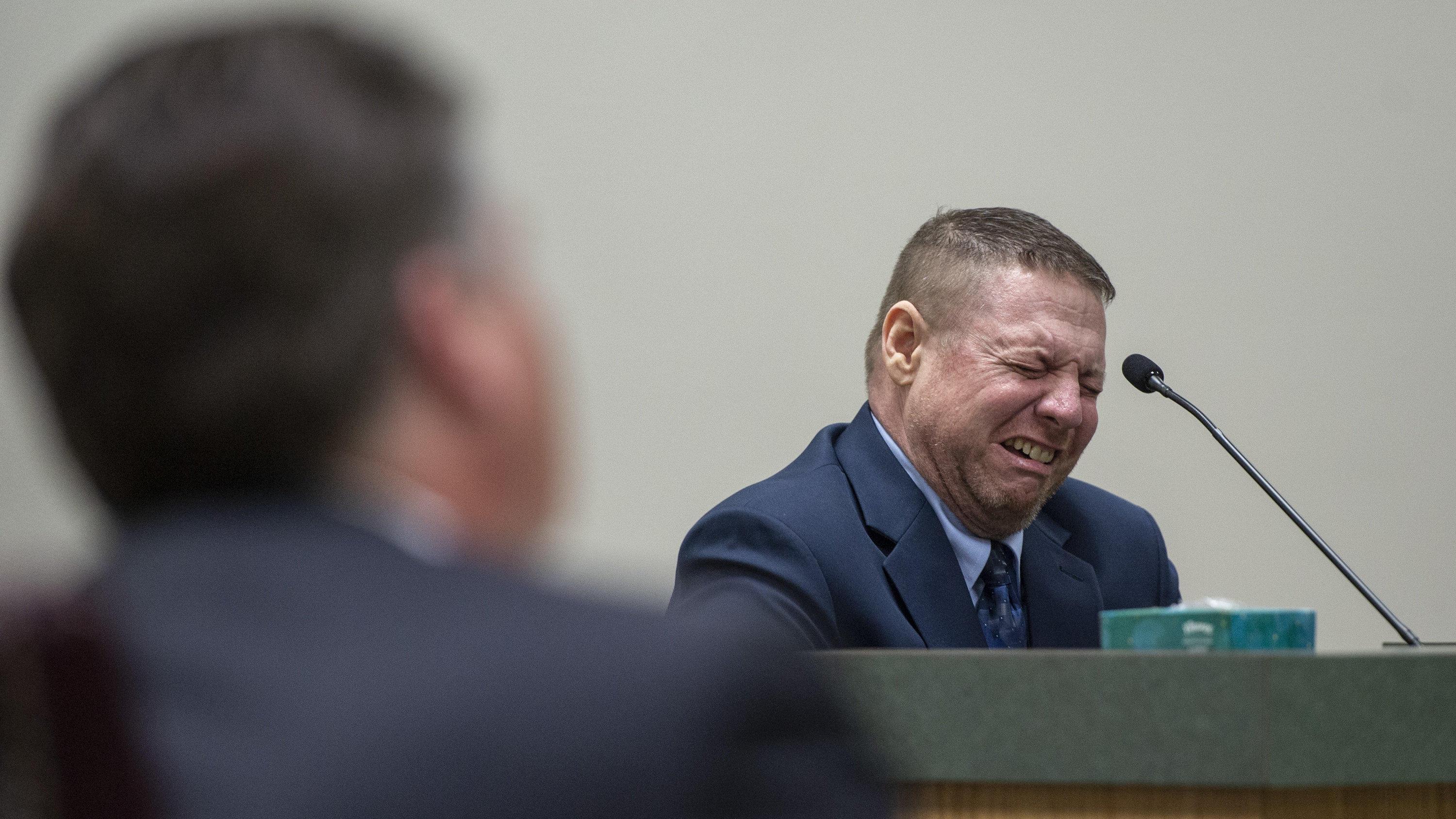 Jacob Blair Scott, who is accused of sexually assaulting a minor, cries out while on the witness stand after testifying about his family relationships after being asked an unrelated question during his trial in Jackson County Circuit Court in Pascago