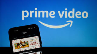 Illustration of Amazon prime video app on mobile device with Prime Video logo in background  in Kolkata , India , on 19 March , 2021.Amazon prime video to produce first Indian bollywood film accoding to media reports.