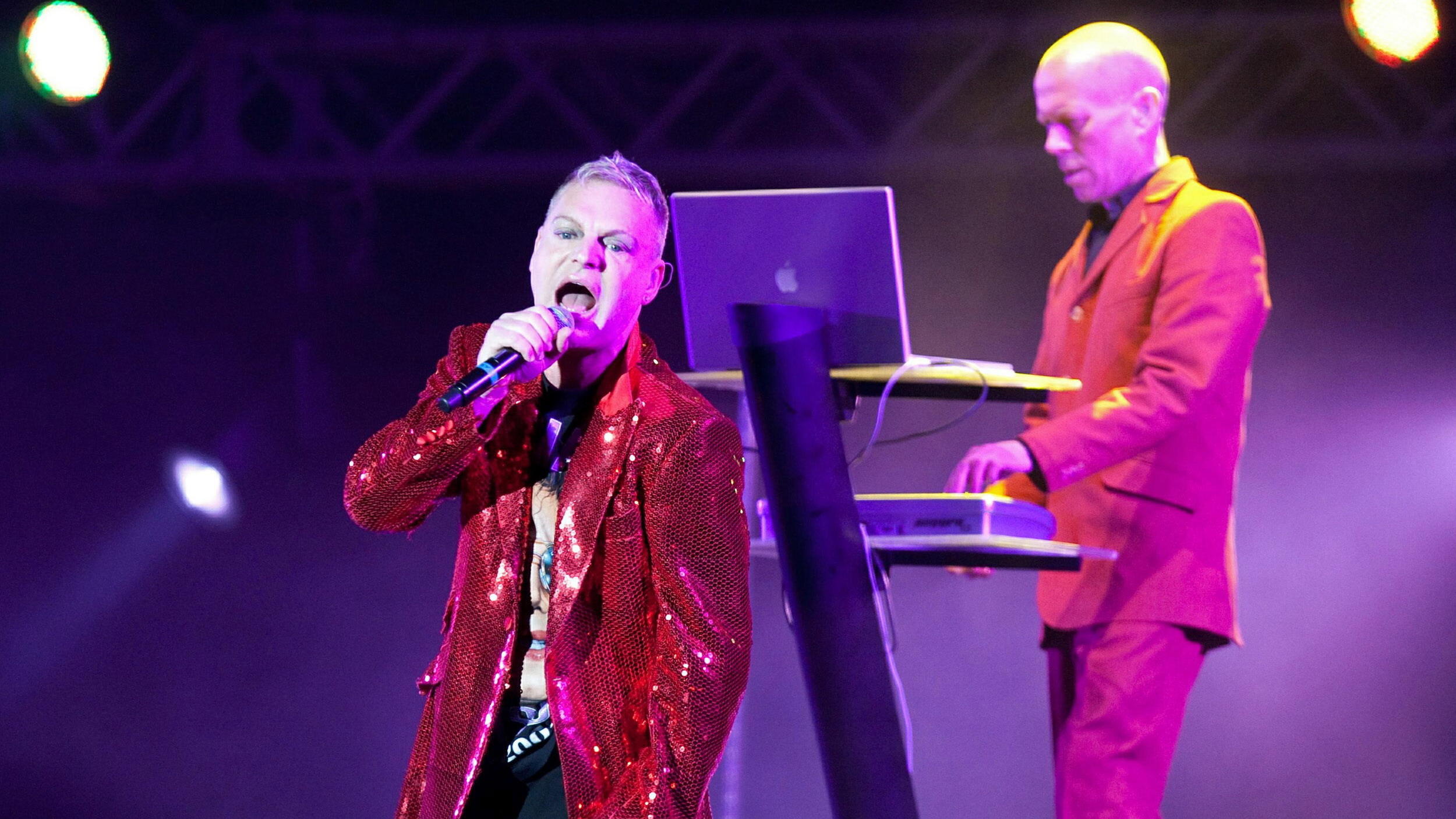 epa02872120 Singer of the English duo Erasure, Andy Bell and Vince Clarke (R) perform during their concert at the Monumental stadium in Lima, Peru, 18 August 2011. The concert is part of the Total Pop Tour. EPA/PAUL VALLEJOS