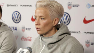 FILE - United States women's national soccer team member Alex Morgan, left, listens as teammate Megan Rapinoe speak to reporters during a news conference in New York, Friday, May 24, 2019. Megan Rapinoe and Alex Morgan were included on the U.S. national team roster for the upcoming CONCACAF W Championship, which will determine four of the regionâ€™s teams in the 2023 Womenâ€™s World Cup.  (AP Photo/Seth Wenig, File)