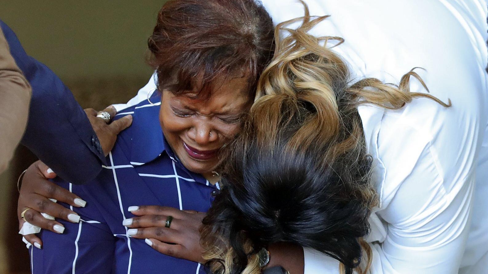 Pamela Walker, left, and Jada Walker, right, get emotional during a news conference following the shooting death of Jayland Walker, Thursday, June 30, 2022, in Akron, Ohio.  Walkler,   shot and killed by police following a vehicle and foot pursuit th