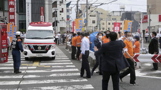 People react after gunshots in Nara, western Japan Friday, July 8, 2022. Japanâ€™s former Prime Minister Shinzo Abe was in heart failure after apparently being shot during a campaign speech Friday in western Japan, NHK public television said Friday. (Kyodo News via AP)