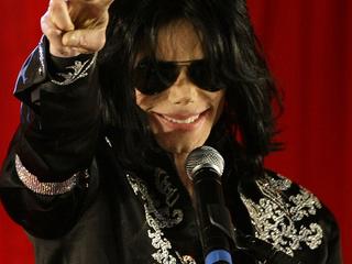 U.S. pop star Michael Jackson gestures during a news conference at the O2 Arena in London in this March 5, 2009 file photo. Michael Jackson, 50, died in Los Angeles on June 25, 2009 after rehearsing for a series of 50 concerts in London. Picture taken March 5, 2009.  REUTERS/Stefan Wermuth/Files (BRITAIN - Tags: ENTERTAINMENT SOCIETY PROFILE OBITUARY ANNIVERSARY)