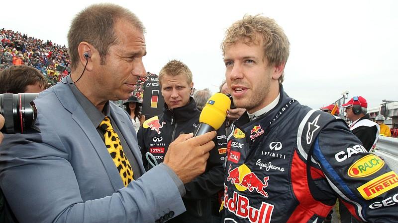 Boxenreporter Kai Ebel (li.) im Gespräch mit Formel 1-Pilot Sebastian Vettel (Foto: 2011)