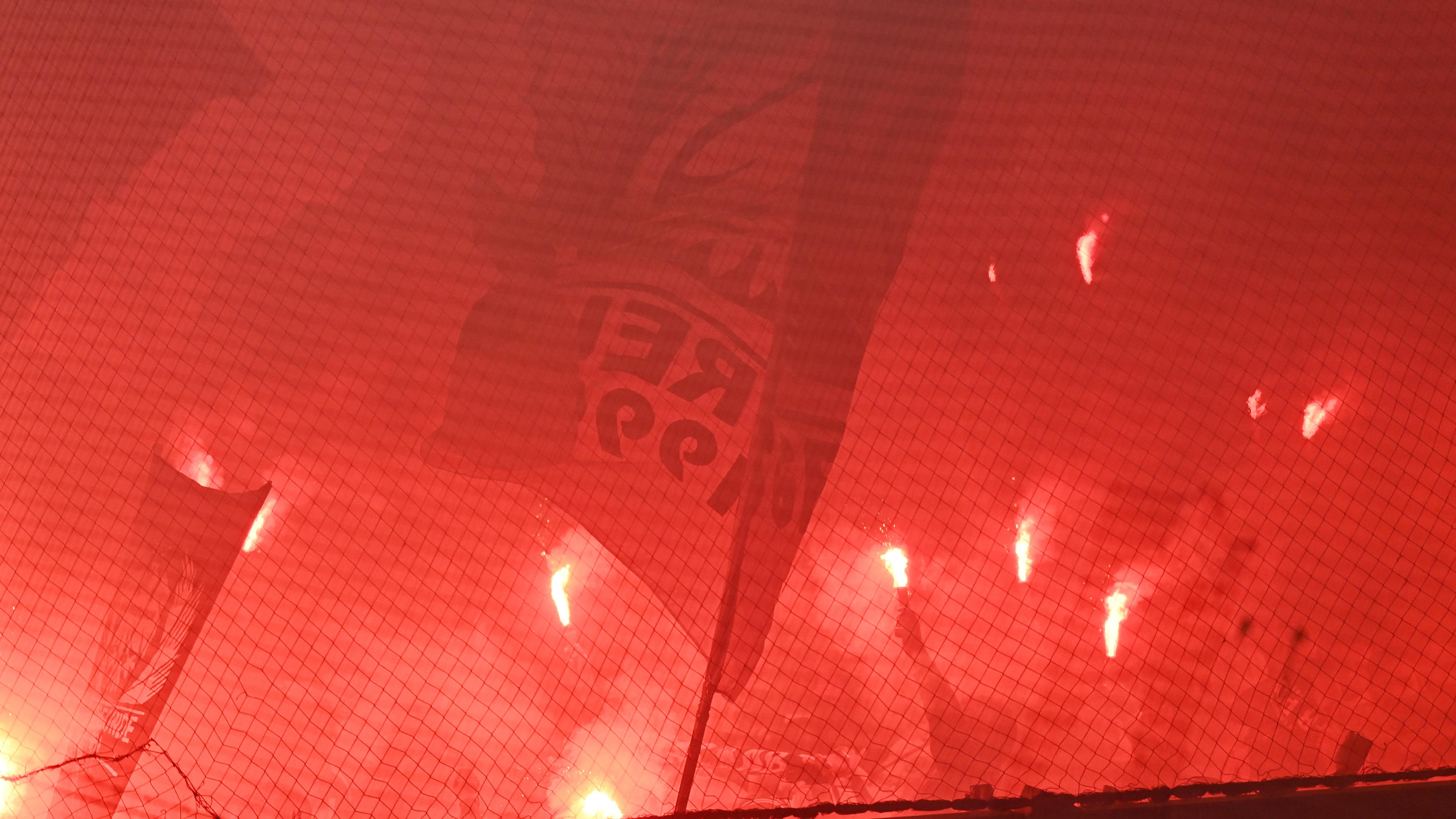 Soccer Football - DFB Cup - First Round - FC Magdeburg v Eintracht Frankfurt - MDCC-Arena, Magdeburg, Germany - August 1, 2022 Eintracht Frankfurt fans with flares REUTERS/Fabian Bimmer DFB REGULATIONS PROHIBIT ANY USE OF PHOTOGRAPHS AS IMAGE SEQUENC