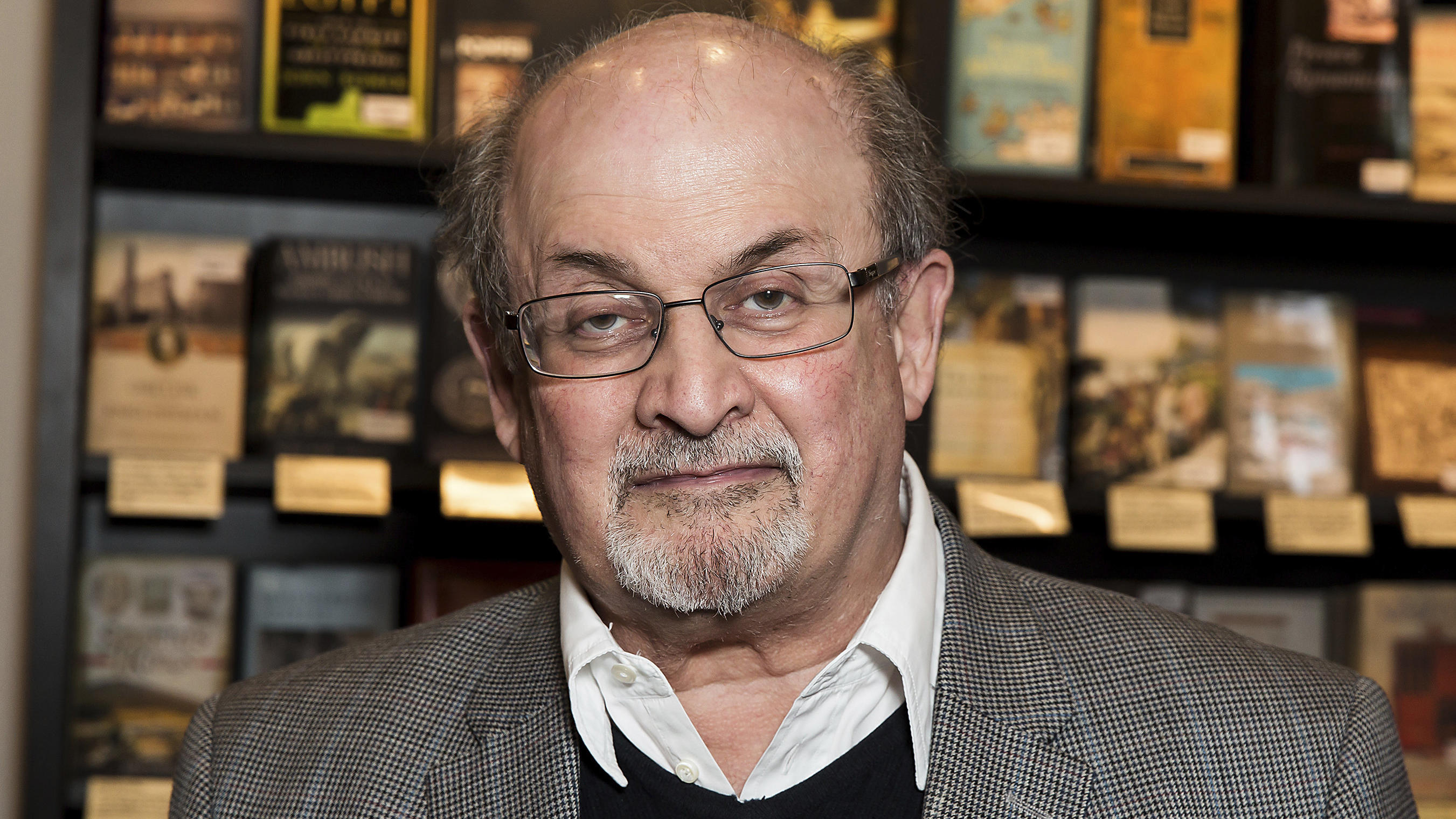 FILE - Author Salman Rushdie appears at a signing for his book "Home" in London on June 6, 2017. Rushdie has been attacked while giving a lecture in western New York. An Associated Press reporter witnessed a man storm the stage Friday at the Chautauq