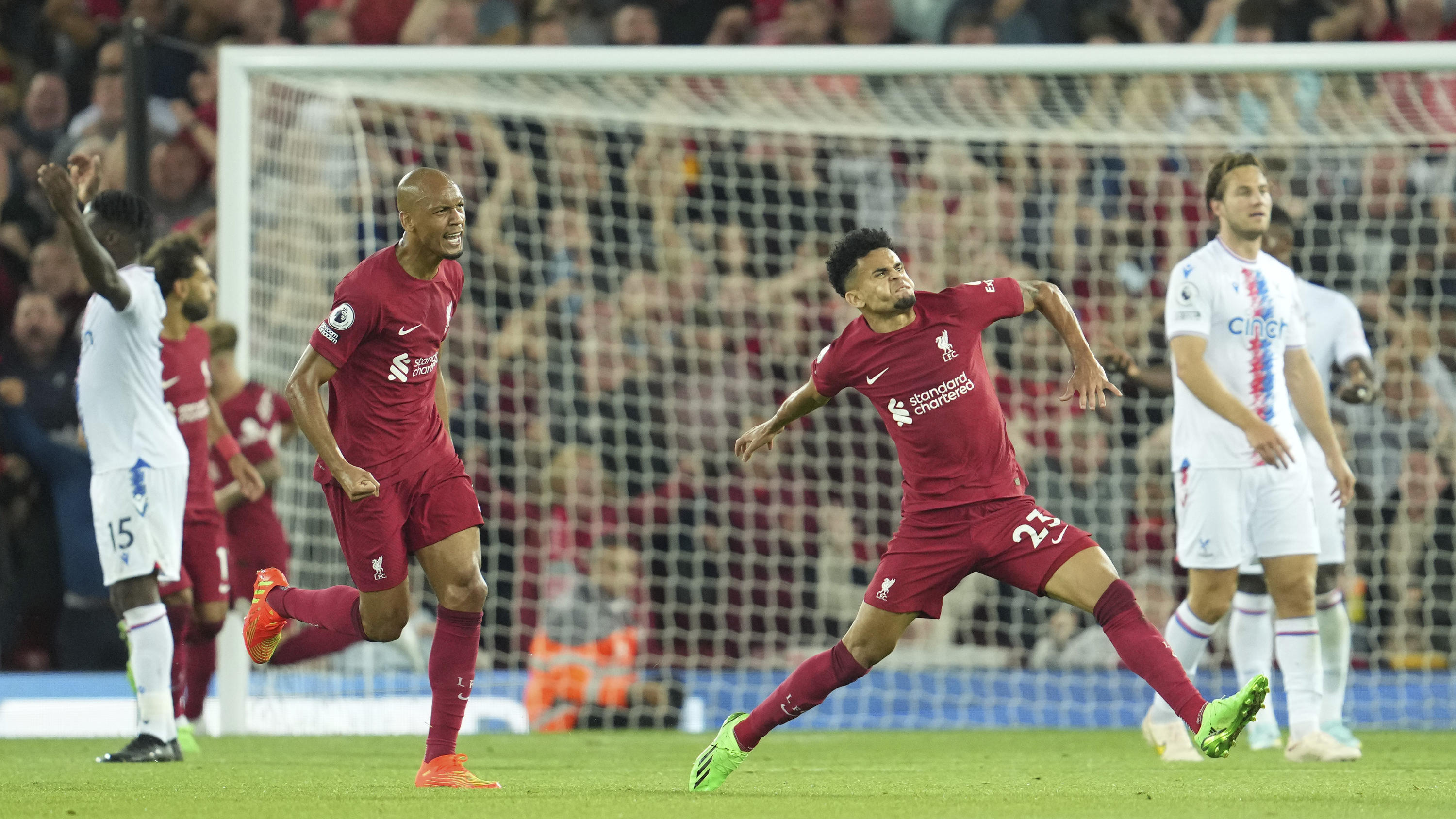 Liverpool's Luis Diaz, right, celebrates after scoring his side's opening goal during the English Premier League soccer match between Liverpool and Crystal Palace at Anfield stadium in Liverpool, England, Monday, Aug. 15, 2022. (AP Photo/Jon Super)