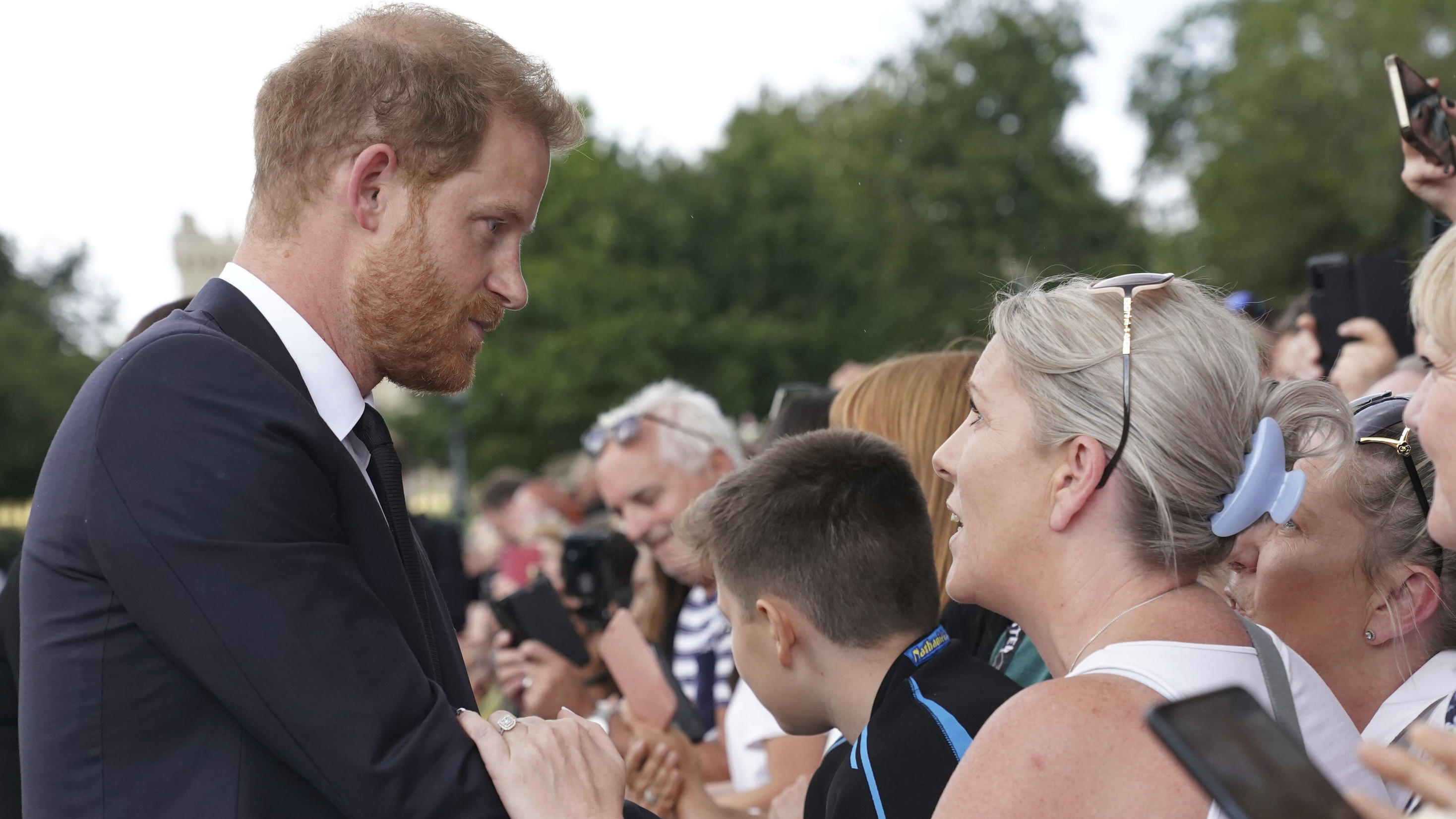 Britain's Prince Harry meets members of the public on a walkabout at Windsor Castle, following the death of Queen Elizabeth II on Thursday, in Windsor, England, Saturday, Sept. 10, 2022. (Kirsty O'Connor/Pool Photo via AP)