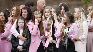 Mourners as the coffin of nine-year-old Olivia Pratt-Korbel is taken to her funeral in Liverpool, Britain, September 15, 2022 REUTERS/Craig Brough