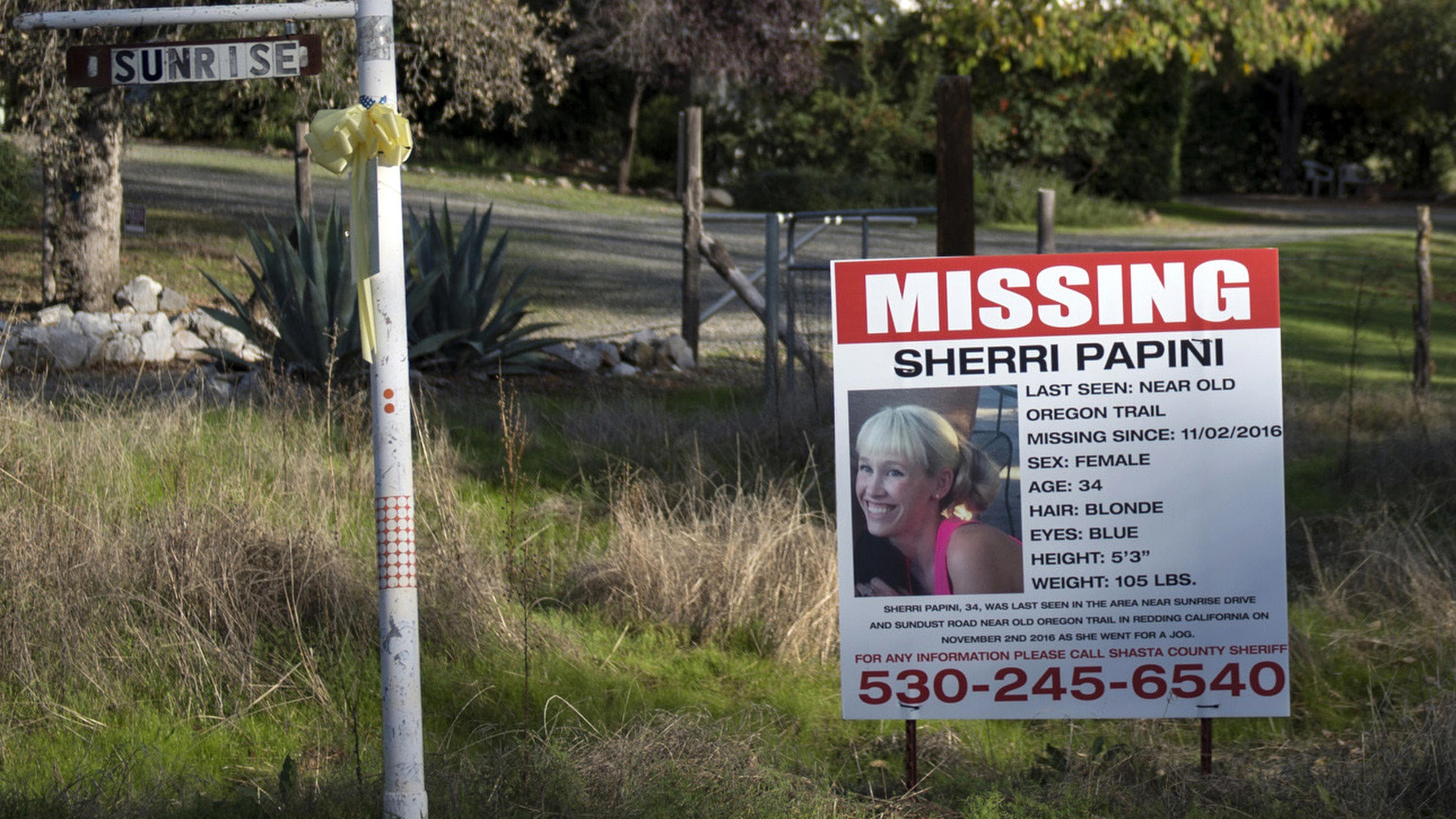 FILE - In this Nov. 10, 2016 file photo, a missing sign for Mountain Gate, Calif., resident Sherri Papini, 34, is placed along side Sunrise Drive, near the location where the mom of two is believed to have gone missing while on a afternoon jog on Nov