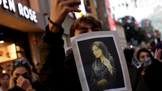A demonstrator holds a picture of Mahsa Amini during a protest march in solidarity with women in Iran, following the death of the young Iranian woman, Mahsa Amini, in central Istanbul, Turkey September 20, 2022. REUTERS/Murad Sezer  NO RESALES. NO ARCHIVES     TPX IMAGES OF THE DAY