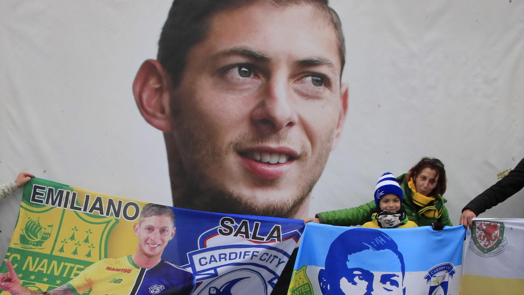 FILE - Cardiff supporters gather to pay tribute to Argentinian soccer player Emiliano Sala prior the French League One soccer match between Nantes against Bordeaux at La Beaujoire stadium in Nantes, western France, on Jan. 26, 2020. A years-long tran
