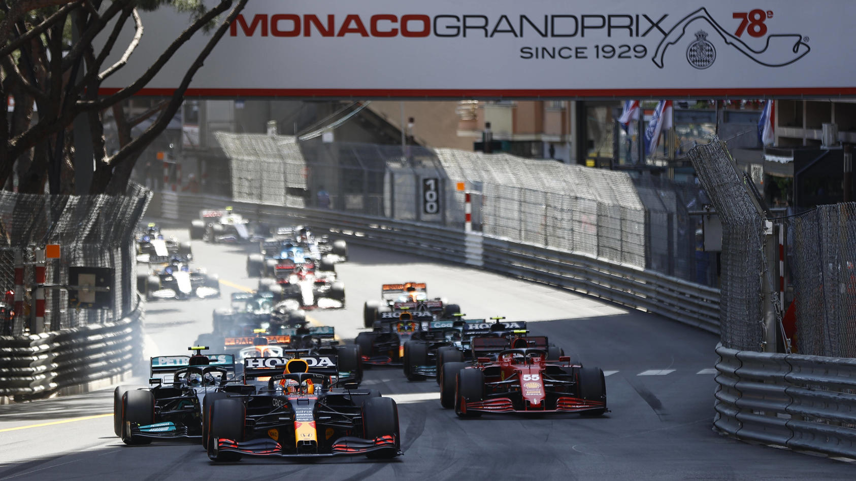 Formula 1 2021: Monaco GP CIRCUIT DE MONACO, MONACO - MAY 23: Max Verstappen, Red Bull Racing RB16B, leads Valtteri Bottas, Mercedes W12, Carlos Sainz, Ferrari SF21, and the rest of the field at the start during the Monaco GP at Circuit de Monaco on 