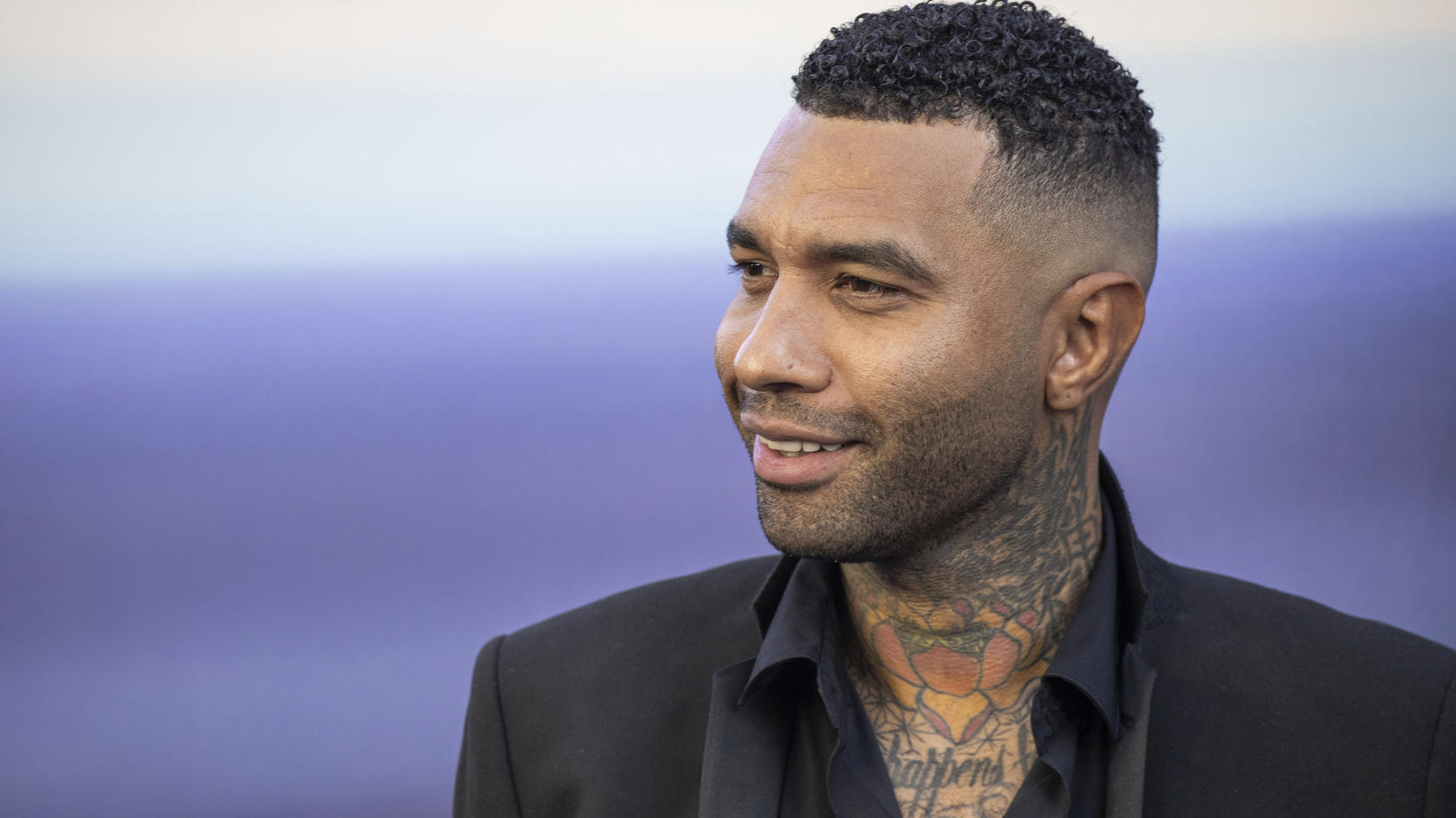 Jermaine Pennant poses for photographers upon arrival for the film's premiere 