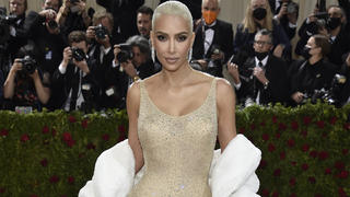 FILE - Kim Kardashian attends The Metropolitan Museum of Art's Costume Institute benefit gala celebrating the opening of the "In America: An Anthology of Fashion" exhibition on Monday, May 2, 2022, in New York. Reality tv star and entrepreneur Kim Kardashian has agreed to settle charges brought by the Securities and Exchange Commission and pay $1.26 million because she promoted on social media a crypto asset security offered and sold by EthereumMax without disclosing the payment she received for the plug. The SEC said Monday, Oct. 3, 2022, that Kardashian has agreed to cooperate with its ongoing investigation.(Photo by Evan Agostini/Invision/AP, File)