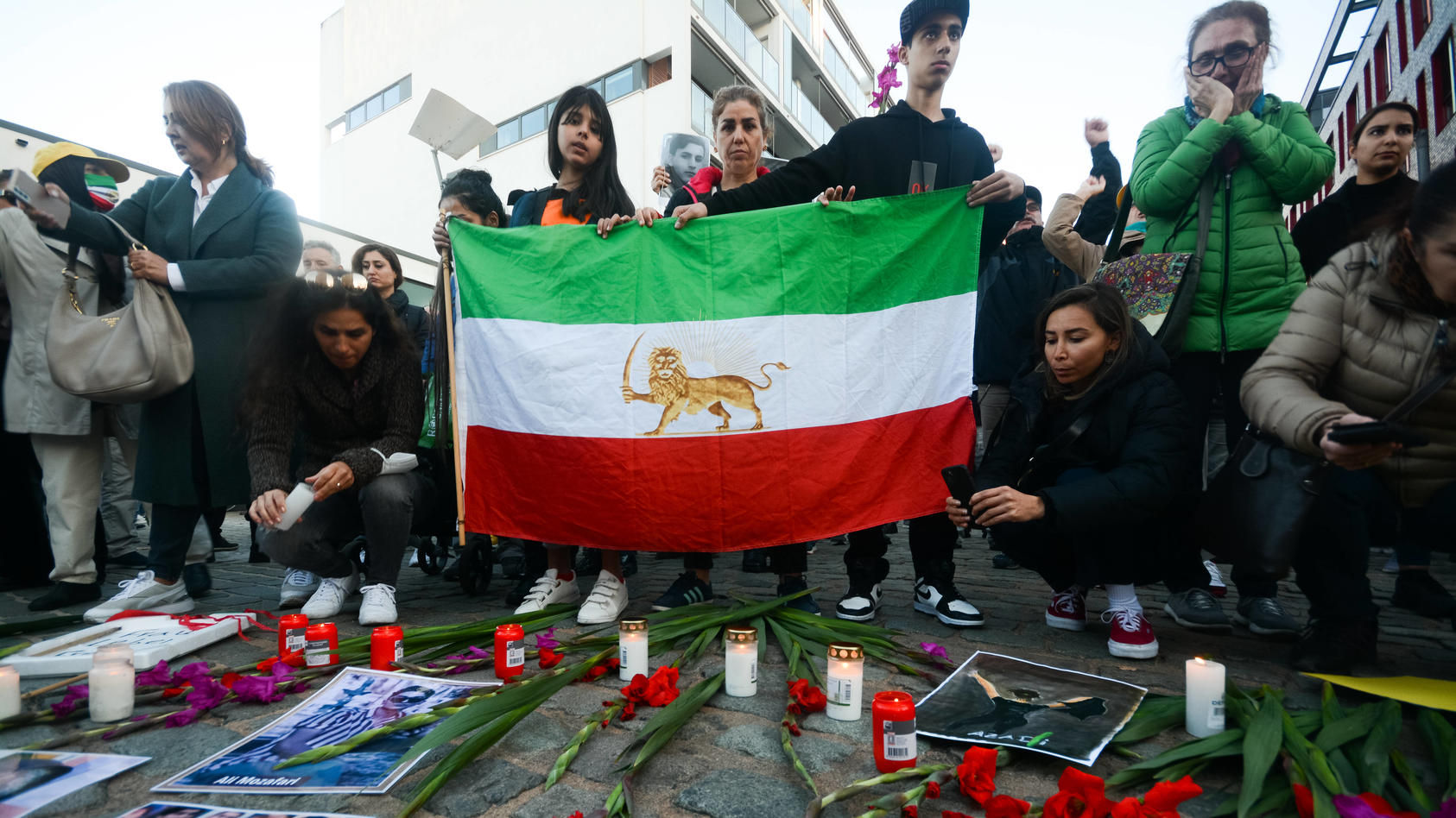  Protest Against Iran Islamic Regime And Vigil For Victims In Cologne protesters are seen laying the flowers and candle with pictures of people who lost their lives during the suppression of uprisings and protests in Iran in Cologne, Germany on Oct 9