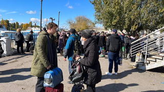RUSSIA, KHERSON - OCTOBER 19, 2022: People gather at the port of Kherson for evacuation. Kherson Region authorities have started organized evacuation of residents of the right bank of the Dnieper River from the port of Kherson. On October 18, Kherson Region Acting Governor Vladimir Saldo announced the evacuation of civilians to the left bank of the Dnieper River due to a threat of flooding that could happen in case the Ukrainian Army hit the Kakhovka Hydroelectric Power Plant. Dmitry Marmyshev/TASS / action press
